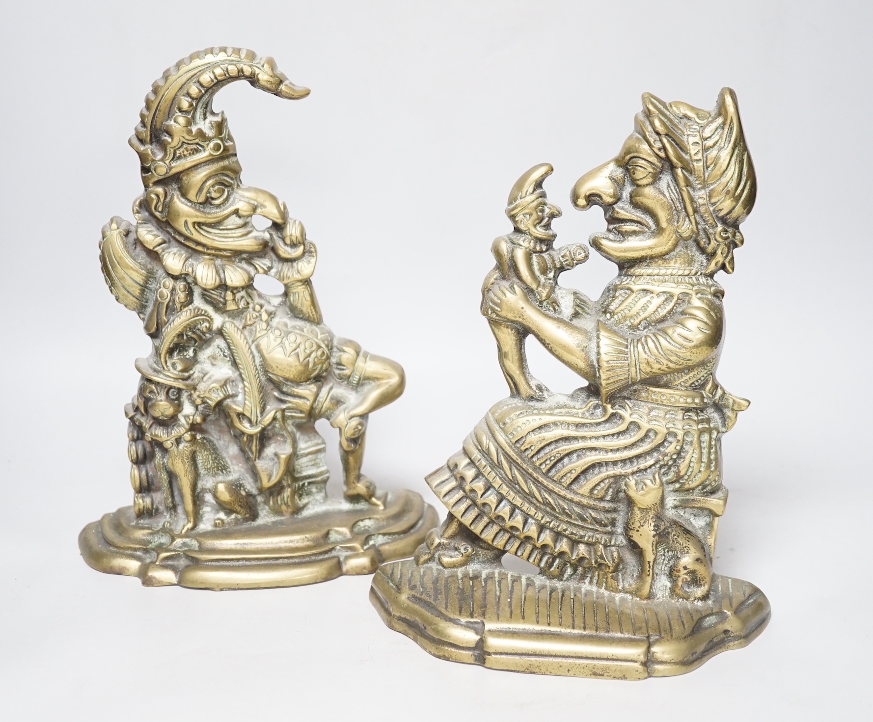 A pair of cast brass Punch and Judy door-stops, the largest 28cm high